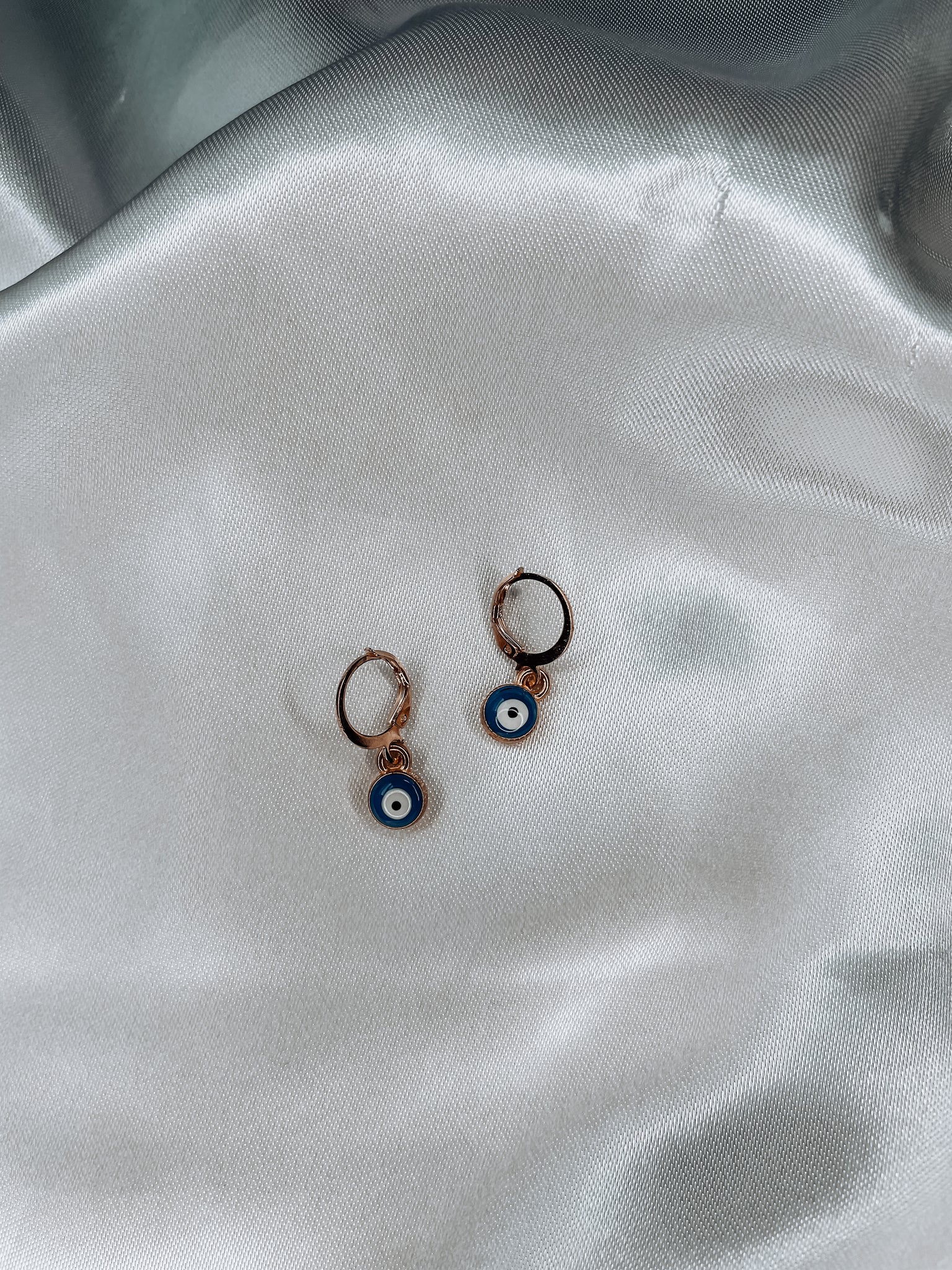 gold evil eye earrings